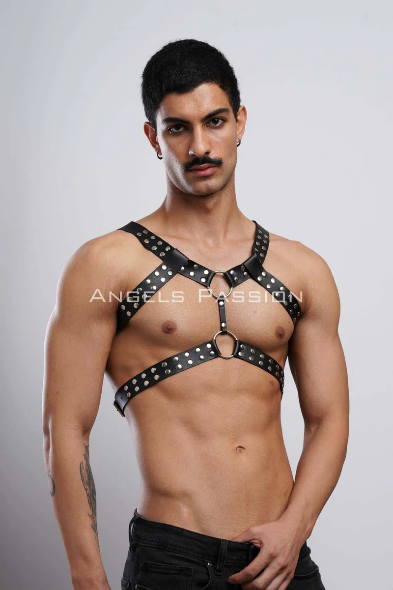 Side profile of studded chest harness emphasizing strap angles