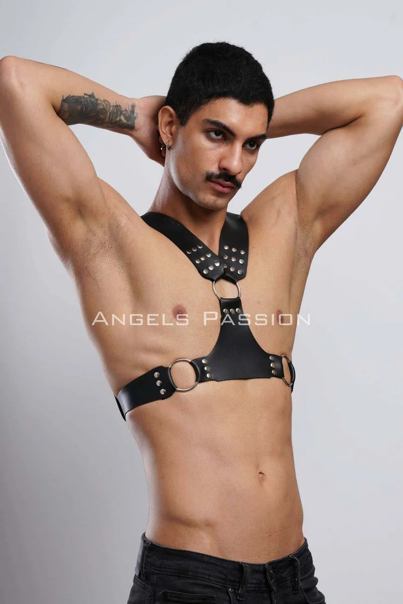 Black studded leather chest harness with O-ring detail and side straps