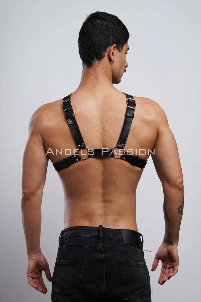 Back view of black faux leather chest harness showing strap adjustability