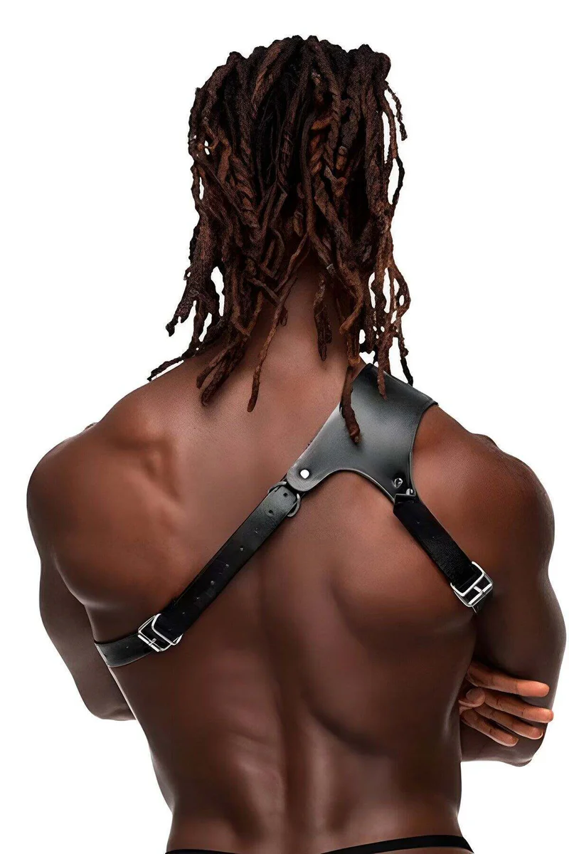 Black vegan leather shoulder harness worn