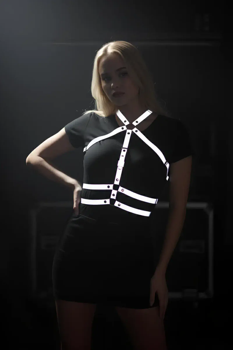 Reflective chest harness with adjustable straps on a model