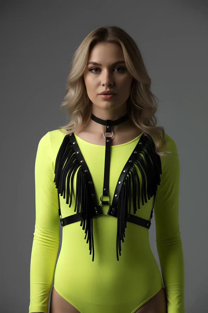 Festival outfit with black faux leather fringe harness and O-ring detail