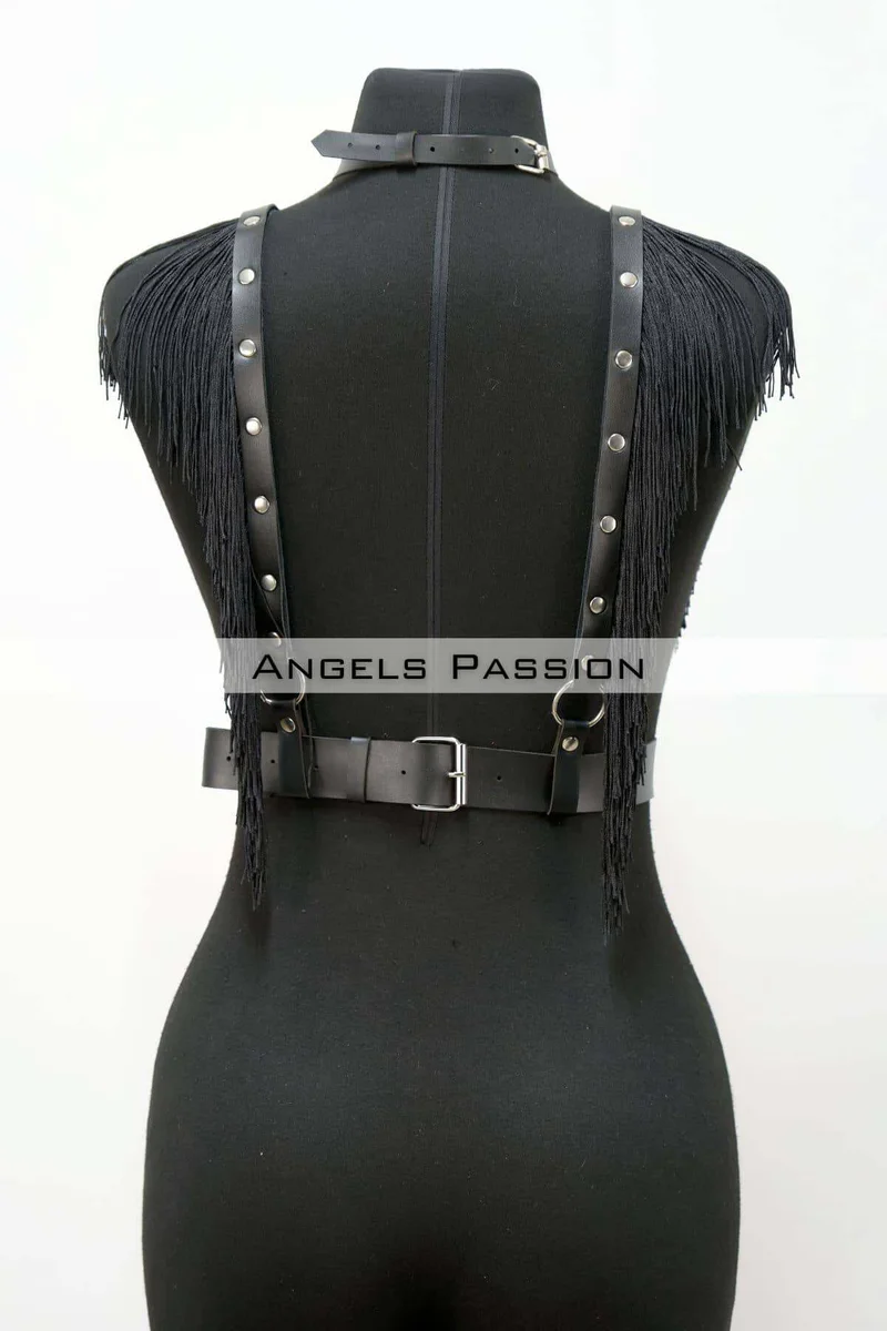 Black faux leather harness with fringe detailing and silver stud accents