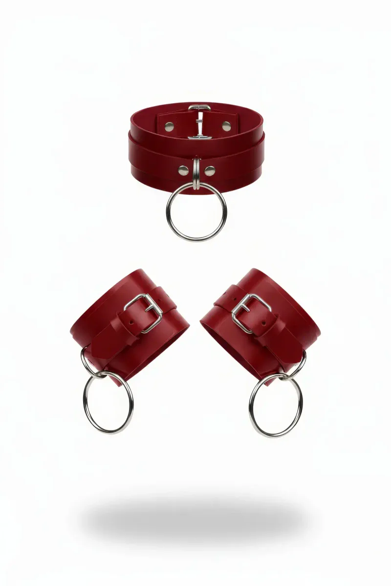 Red faux leather choker and wrist cuffs with silver O-ring details