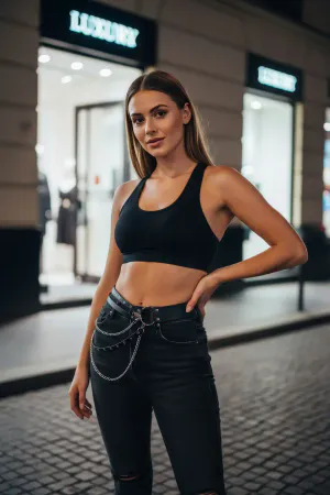 Black Faux Leather Waist Harness with Silver Chain Detailing over Blue Jeans