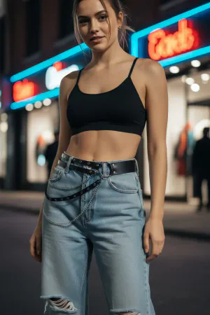 Black Faux Leather Waist Harness with Silver Chain Detailing over Blue Jeans