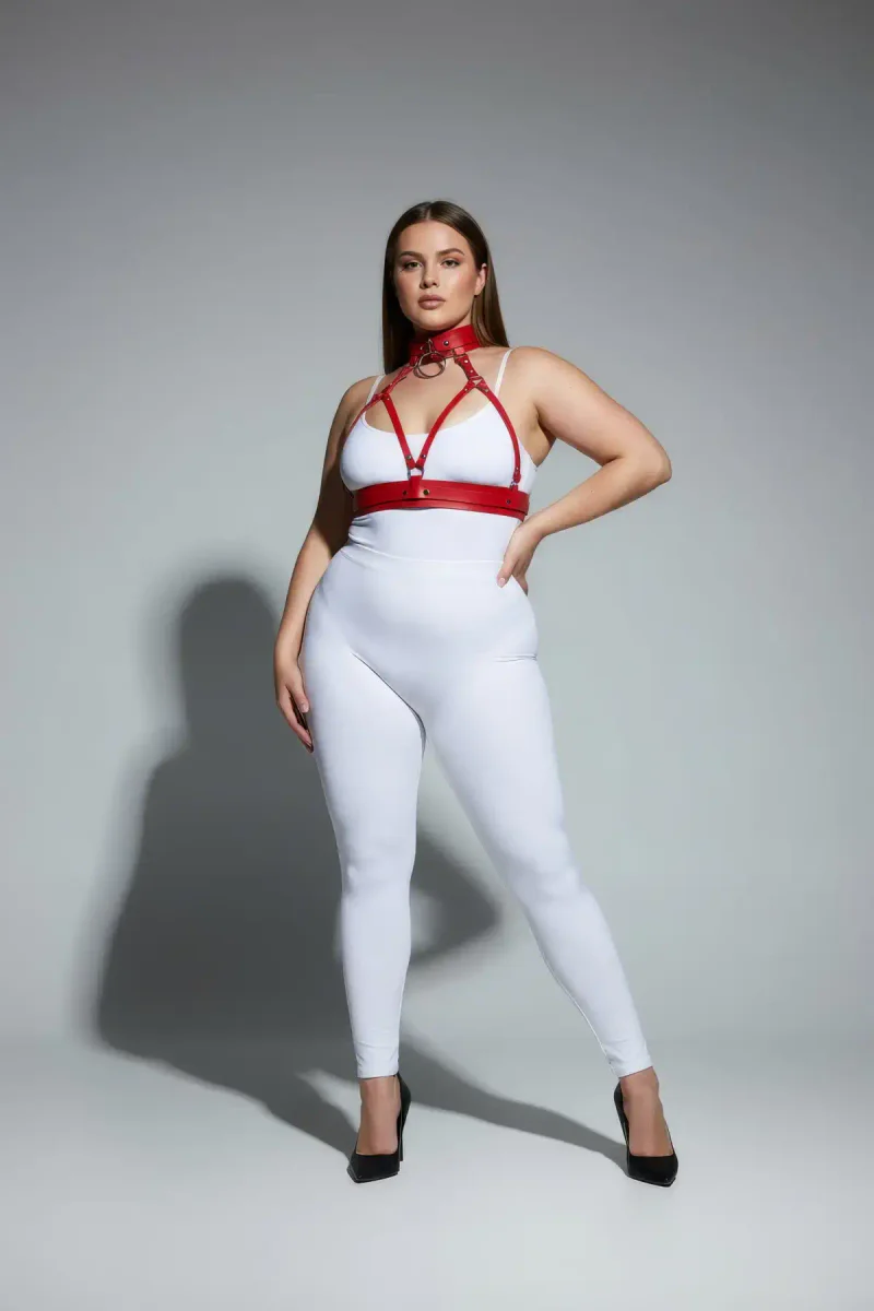 Red strappy harness set with choker and o-ring worn by plus size model